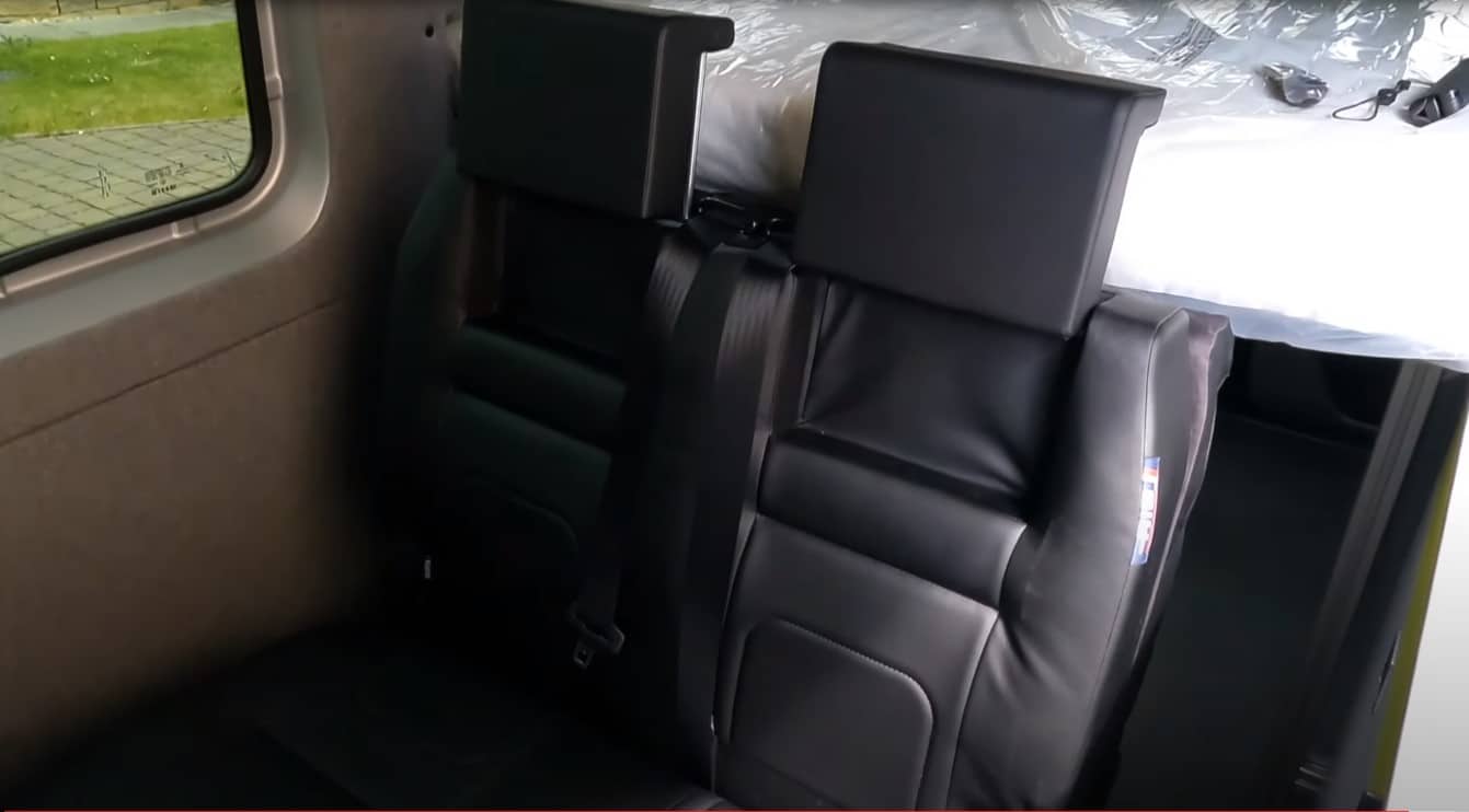 https://www.richsautobodyshop.com/wp-content/uploads/2023/08/truck-bed-seats-with-seat-belts.jpg